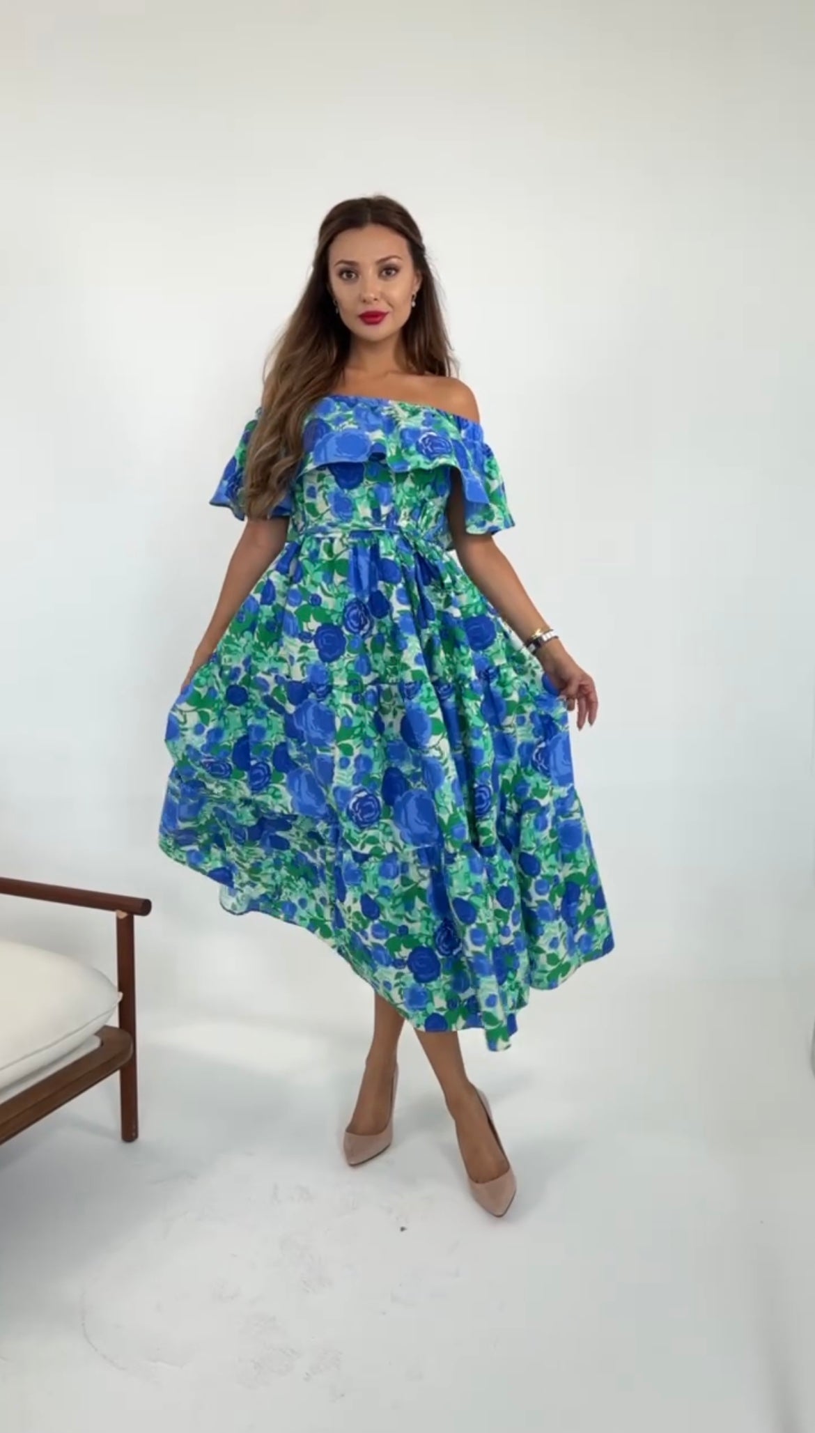 Front view of model wearing off the shoulder ruffle hem floral print dress