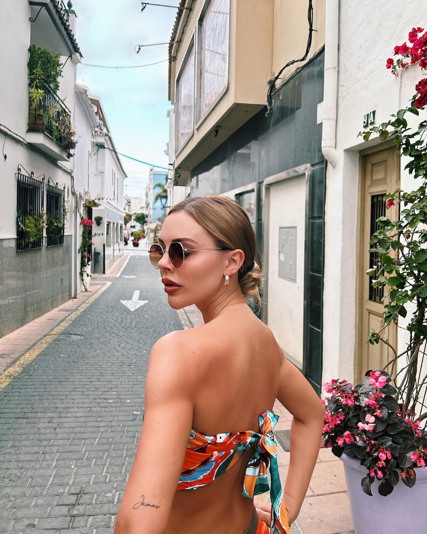 Back View of Model outside wearing Women's Multi-Print Two Piece Set